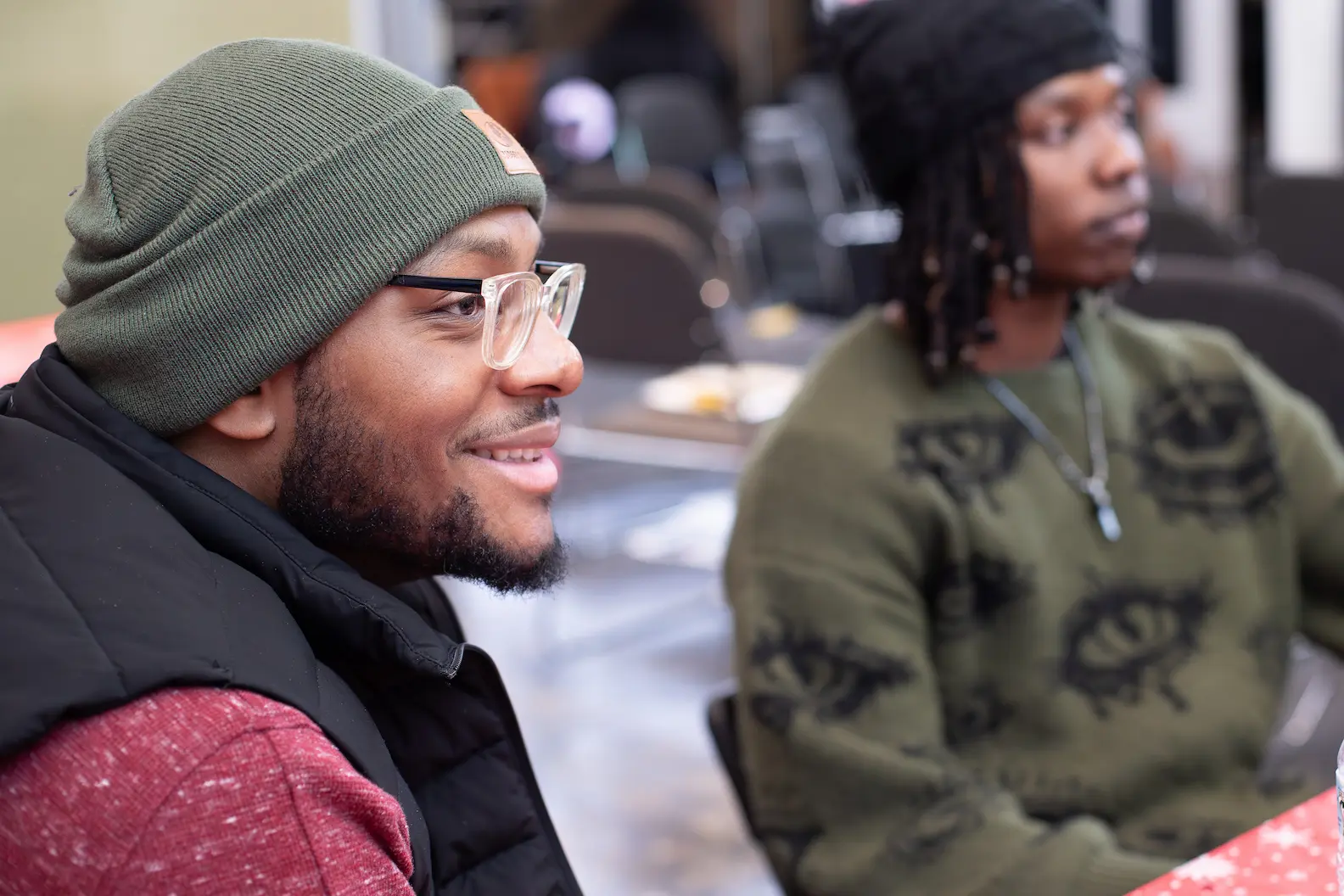 Volunteers mentoring youth during a community session